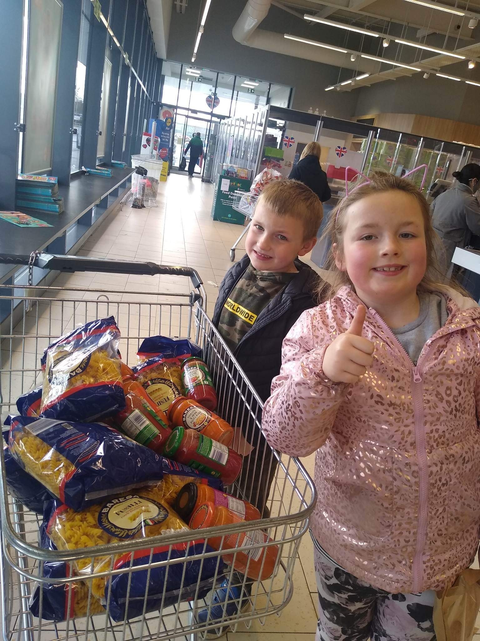 Ava and Arlo with their food for Feeding Families 