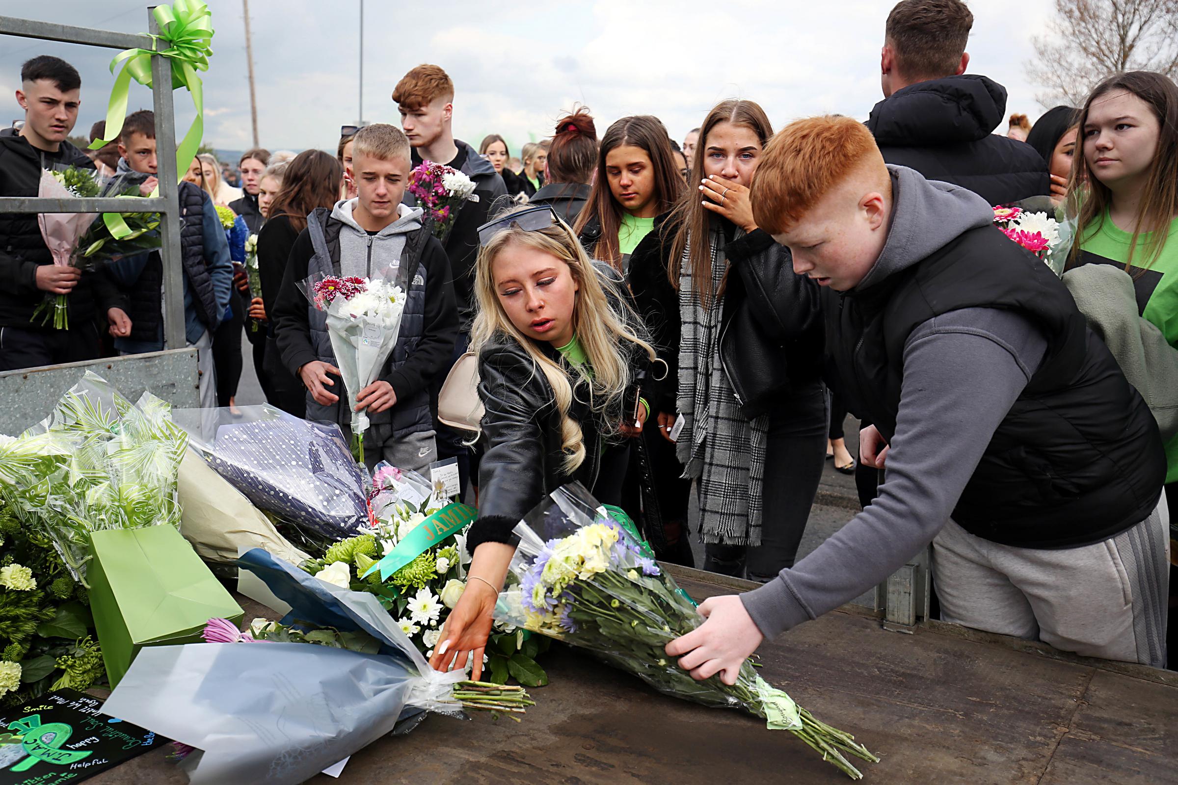 Young mourners leave their floral tributes for Jamie McKitten 