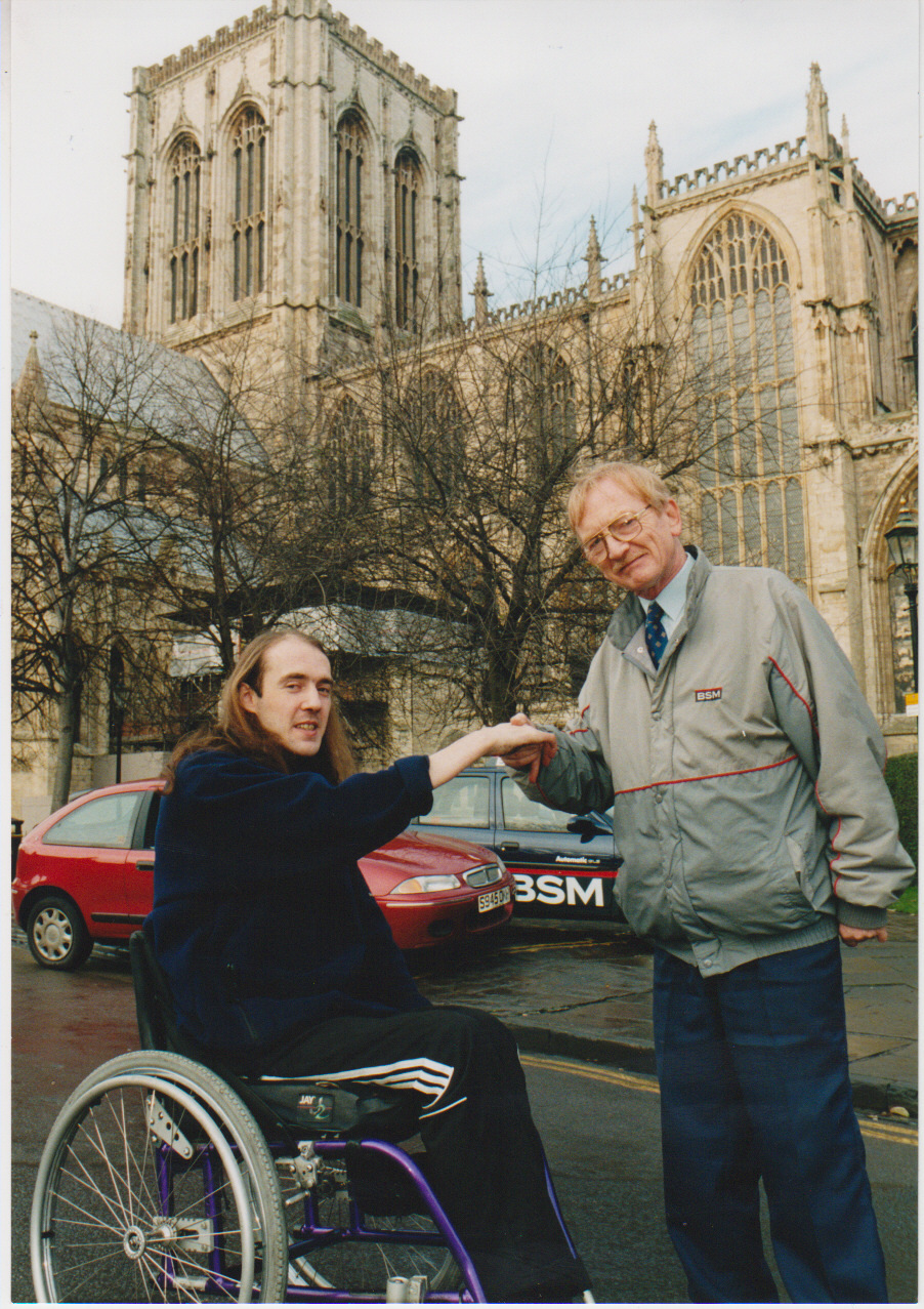 Martin Hall is congratulated by his BSM instructorJohn Trevitt in1998