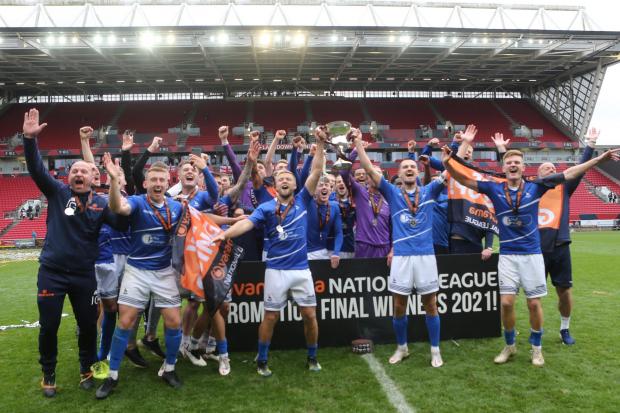 The Northern Echo: Hartlepool players including Shelton (right) lift the trophy. PICTURE: MARK FLETCHER