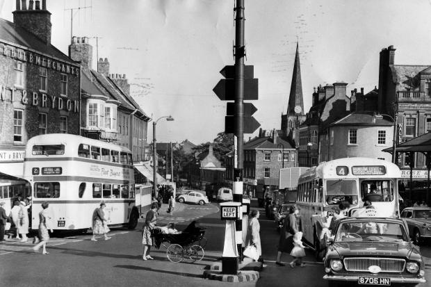 A busy street scene in Tubwell Row in September 1963. That lady is pushing a pram that must have come from Thornleys in Northgate