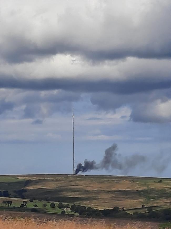 Black smoke billows from TV mast on fire in the North York Moors