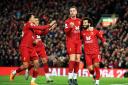 Jordan Henderson celebrates with his Liverpool team-mates - the Wearsider has been a key part of the Reds' title triumph