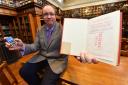 Librarian David Harrington with the copy of Geoffrey Faber’s The Buried Stream which was returned to Middlesbrough’s Central Library