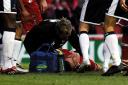 Middlesbrough young star James Morrison is treated on the pitch after being knocked unconscious following being struck in the head by a Spur boot while diving to head the ball in the box during the final minutes of the match at the Riverside