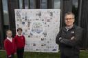 Alan Patrickson, Durham County Council’s director of neighbourhoods and climate change, with Martha Manning and Toby Horton from Neville’s Cross Primary School and the winning Big Draw banner desig