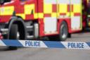 One arrested after suspected arson destroys caravan and cars