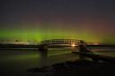 The Northern lights on view over Belhaven bridge in Dunbar Scotland. Pictures: PA