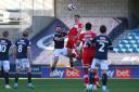 Boro defender Dael Fry challenges for a header against Millwall