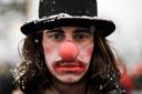 A man made up as a clown attends a demonstration against the annual meeting of the World Economic Forum in Davos Picture: MARKUS SCHREIBER/AP