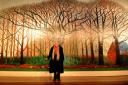 Artist David Hockney stands in front of his most recent work, Bigger Trees Near Warter, on display at York Art Gallery  Picture: Anthony Chappell Ross