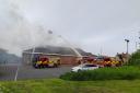 Firefighters tackle a blaze at the Iceland supermarket in Stanley.