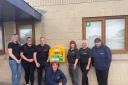 Members of the Visuna team with the new defibrillator