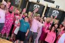 Pink is the adopted colour for Valhalla North Axe Throwing's annual Burn Battle tournament, with group picture from 2022