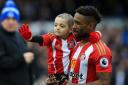 Bradley Lowery in the arms of his hero and charity supporter Jermain Defoe before a Sunderland game