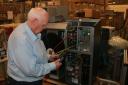 John Elliott working on a heat pump