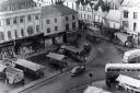 Doggarts' Auckland House headquarters in Bishop Auckland Market Place in the 1950s with loads of buses bringing customers to its doors