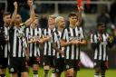Lewis Miley and his Newcastle teammates celebrate the win over Chelsea