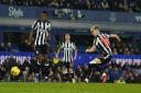 Anthony Gordon fires in a shot in Newcastle's defeat at Everton