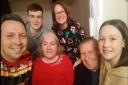 Carol Tate, 73, with her family during her last Christmas