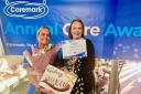Caremark Redcar and Cleveland Carer of the Year Michelle Burr, left, is presented with her award