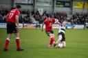 Darlington's Hayden Lindley makes a challenge in his side's defeat to Tamworth