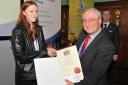Aimee Hughes receives her scholarship certificate from Dr Stuart Millman at the 7th Postgraduate Research Symposium on Ferrous Metallurgy held in London