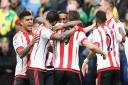 Sunderland's players celebrate after Jermain Defoe's goal