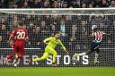 Alexander Isak heads home Newcastle's opening goal