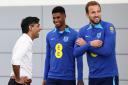 Prime Minister Rishi Sunak (left) meets Marcus Rashford (centre) and Harry Kane during a visit to St George's Park