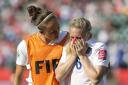 Emotional: England's Josanne Potter, left, consoles Laura Bassett after the team's 2-1 loss to Japan