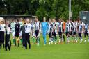 TRIBUTE: The two teams walk out before game. Picture: Richard Leach