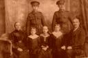 ANY INFORMATION: Lance Corporal John James Storey, of Shildon, back right, with his mother Isabella and stepfather George Sherwood, and his step-siblings in the front
