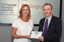 Colin Fyfe is presented with the award by Joanne Atkin Editor of Mortgage Finance Gazette. Picture: DAVID BERMAN