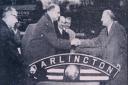 RAIL HANDOVER: Chairman of Darlington FC John Neasham, right, receives the nameplate from the scrapped steam engine in December 1960 from a British Rail official