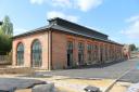 SOCIAL HOUSING: The restored Haughton Road engine shed, as seen this week, as it nears the end of its conversion. The housing on top of the roof is a clerestory - a ventilator that let the steam and smoke from the engines escape