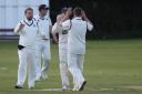 Martons' Matthew Connelly celebrates with his team mates after getting Marske's Craig Gratton LBW
