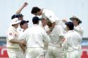 Cricket - Gary Pratt is mobbed by his teammates during his Ashes run-out of Ricky Ponting.