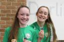 STAR SWIMMERS: Harriet Rogers with her five medals and Molly Mooney