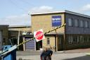 Sad day: A worker leaves the Remploy factory, in Spennymoor