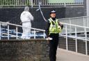 Police and forensic investigators at Amman Valley School (Ben Birchall/PA)