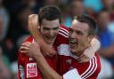 Middlesbrough's Adam Johnson (left) celebrates scoring the opening goal against Scunthorpe United with Tony McMahon (right) during a Coca-Cola Championship match at Glanford Park, Scunthorpe in August.