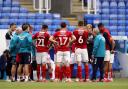 Neil Warnock speaks to his players in the wake of Middlesbrough's crucial 2-1 win at Reading on Tuesday night