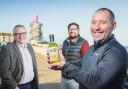 Steve Gill, Andy Mogg and Arron Stoutt with LemonTop Gin at Redcar beach