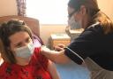 Staff member Emma Saunders receives a welcome dose of Covid vaccine at Woodhorn Park Care Home