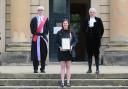 Jemma Clark, commended for helping road accident victims, by Judge James Adkin, left, and High Sheriff, Robert Harle  Picture: SARAH CALDECOTT