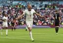 Harry Kane celebrates after heading home Jack Grealish's cross to double England's lead