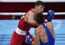 Pat McCormack, of Great Britain (left), lands a punch to Belarus' Aliaksandr Radzionau during their welterweight preliminary bout at the Tokyo Olympics (Picture: AP Photo/ Frank Franklin II)