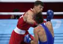 Pat McCormack, of Great Britain (left), lands a punch to Belarus' Aliaksandr Radzionau during their welterweight preliminary bout at the Tokyo Olympics (Picture: AP Photo/ Frank Franklin II)