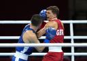 Pat McCormack survives a blow from Bobo-Usmon Baturov